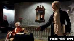 Wax figures of President John Adams, left, and President Thomas Jefferson, right, are on display as part of an American Presidents exhibit at Madame Tussaud's wax museum in Washington, Tuesday, Feb. 15, 2011