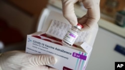 FILE - In this March 3, 2021 file photo ,a package of the AstraZeneca COVID-19 vaccine is shown in the state of Brandenburg where the first coronavirus vaccinations are given in doctors' surgeries, in Senftenberg, Germany. The German government says it is