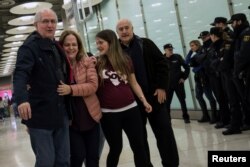 FILE - Antonio Ledezma, Venezuelan opposition leader, left, walks with his wife, Mitzy Capriles, and daughter, Antonietta, upon arriving at Adolfo Suarez Madrid Barajas airport in Madrid, Nov. 18, 2017.