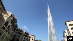 Burj Khalifa, the world's tallest building, seen at center, in Dubai, United Arab Emirates, Sunday, 3 Jan. 2010