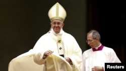 Pope Francis leaves at the end of a mass in Saint Peter's basilica at the Vatican, Feb. 2, 2016. 