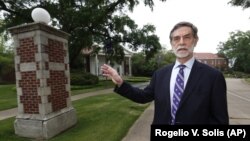 Millsaps College president Robert W. Pearigen speaks about the history of some of the buildings at the small liberal arts college in Jackson, Miss., Friday, April 3, 2020. (AP Photo/Rogelio V. Solis)