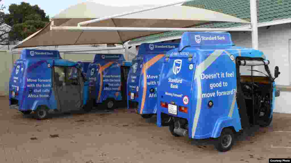 A small fleet of blue Shesha Tuks &ndash; advertising a local Standard Bank - await the call of the dispatcher at the company&rsquo;s Johannesburg office. (Photo by Darren Taylor)