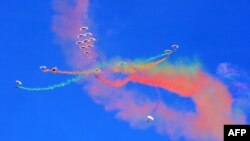 Member of Qatar&#39;s air sport committee perform during the Kuwait aviation show in Kuwait City.