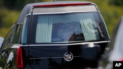 A hearse caring the casket of Bobbi Kristina Brown leaves her funeral service, Aug. 1, 2015, in Alpharetta, Georgia.