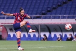 USA's forward Christen Press shoots to score the fourth goal during the Tokyo 2020 Olympic Games women's group G first round football match between New Zealand and USA at the Saitama Stadium in Saitama on July 24, 2021.