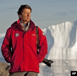 James Balog, pictured here in Greenland, has designed, programmed and installed time-lapse cameras on glaciers to record the impact of a warming climate.