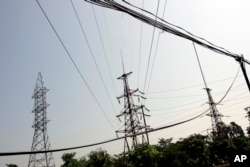 FILE - Power lines are seen in Ninh Binh Power Plant, which is a coal fired power plant to supply electricity, in Ninh Binh Province in Vietnam, Sept. 19, 2007.