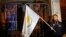 An anti-Troika protester holds a Cypriot flag during a demonstration outside the EU offices in Nicosia Mar. 24, 2013.