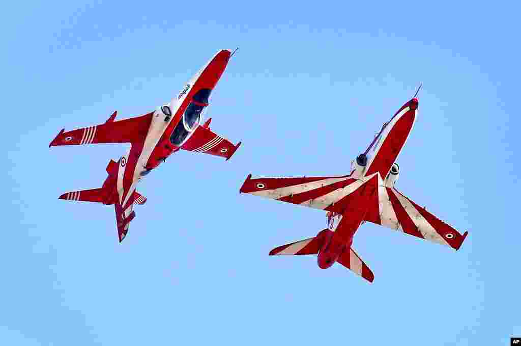 Indian Air Force Suryakiran aircraft perform aerobatic maneuvers on the third and final day of the Aero India 2021, at Yelahanka air base in Bengaluru, India.