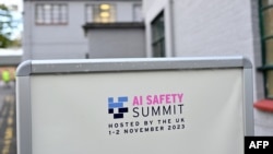 FILE - A sign for the AI Safety Summit at Bletchley Park, near Milton Keynes, north of London on Oct. 26, 2023.