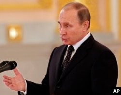 Russian President addresses newly arrived foreign ambassadors of 15 countries during receiving credentials ceremony in Moscow's Kremlin, Russia, Nov. 26, 2015.