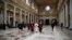 Newly elected Pope Francis (C), Cardinal Jorge Mario Bergoglio of Argentina, walks in the 5th-century Basilica of Santa Maria Maggiore during a private visit in Rome, March 14, 2013.