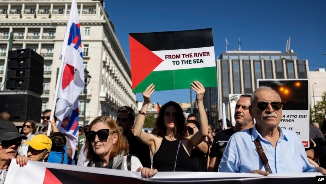 FILE - Pro-Palestinian protesters take part in a rally to express solidarity with Palestinians, in front of the parliament in Athens, Greece, on Nov. 5, 2023.