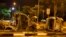 The burnt shells of vehicles are pictured along Race Course Road following a riot near Singapore's Little India district, Dec. 9, 2013.