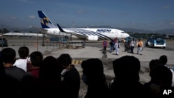 Unaccompanied Guatemalan children who were deported by plane from Mexico arrive at La Aurora International Airport in Guatemala City, Aug. 26, 2021.