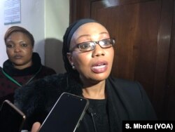 FILE - Priscilla Chigumba, the chairperson of Zimbabwe Election Commission, speaks to reporters in Harare, June 14, 2018.