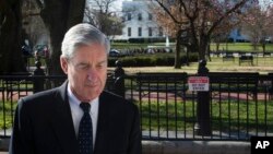 Special Counsel Robert Mueller walks past the White House after attending services at St. John's Episcopal Church, in Washington, Sunday, March 24, 2019.