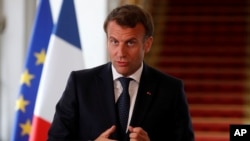 French President Emmanuel Macron speaks after a video-conference summit on vaccination at the Elysee Palace in Paris, May 4, 2020. 