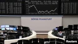 FILE - The German share price index DAX graph is pictured at the stock exchange in Frankfurt, Germany, March 25, 2020.