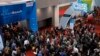 Crowds enter the convention center on the first day of the CES tech show in Las Vegas, Jan. 7, 2020.