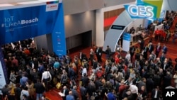 Crowds enter the convention center on the first day of the CES tech show in Las Vegas, Jan. 7, 2020.
