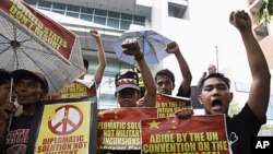 Demonstrators protest against what Manila claims to be Chinese intrusions into Spratly Islands territories claimed by the Philippines front of the Chinese consulate in Makati's financial district of Manila June 8, 2011.