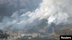 FILE - An aerial views shows a forest fire on a mountain in Ofunato, Iwate Prefecture, northeastern Japan, February 28, 2025, in this photo taken by Kyodo. (Kyodo/via Reuters) 