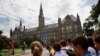 FILE - Prospective students tour Georgetown University's campus in Washington, D.C., July 10, 2013.