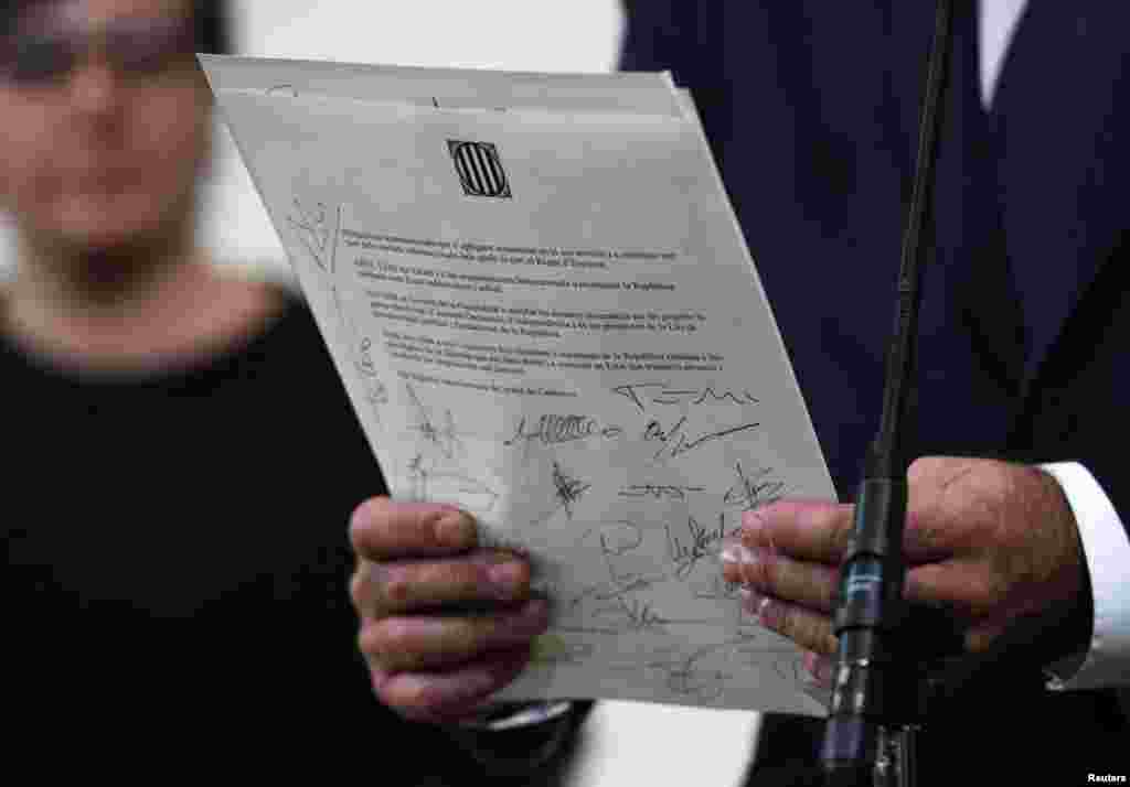 A declaration of independence is seen after it was signed by members of the Catalan regional government at the Catalan regional parliament in Barcelona, Spain.