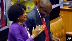 FILE: Cyril Ramaphosa is cheered by Parliament Speaker Baleka Mbete, left, after being elected President in Parliament in Cape Town, South Africa, Feb. 15, 2018.