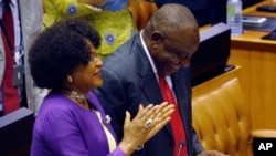 Cyril Ramaphosa is cheered by Parliament Speaker Baleka Mbete, left, after being elected President in Parliament in Cape Town, South Africa, Feb. 15, 2018.