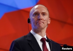 FILE - Carter Page, a one-time adviser of President Donald Trump, addresses the audience during a presentation in Moscow, Dec. 12, 2016.