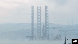 The "Kolskaya" oil drilling rig is pictured in the Kola Bay near Russia's northern seaport of Murmansk. The oil drilling rig with 67 crew on board capsized and sank off the Russian Far East island of Sakhalin when it ran into a storm while being towed, an