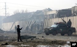 Afghan security forces man at the site a day after an attack in Kabul, Jan. 15, 2019.