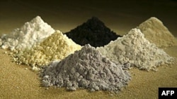 Rare earth oxides from top center clockwise: praseodymium, cerium, lanthanum, neodymium, samarium, and gadoliniun