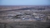 This aerial photo taken from a helicopter shows Ain al-Asad air base in the western Anbar desert, Iraq, Sunday, Dec. 29, 2019. An Iraqi general said Sunday that security has been beefed up around the Ain al-Asad air base, a sprawling complex that hosts U.S. forces