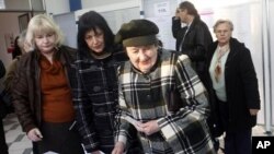 Voters wait for their ballots at a polling station in Zagreb, Croatia, December 4, 2011.