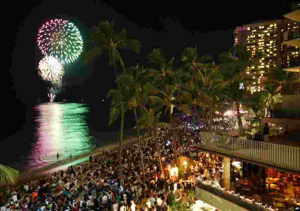 Fireworks explode over Waikiki Beach to ring in the new year in Honolulu, Hawaii January 1, 2012. Hawaii is one of the last places on earth to usher in the New Year. (Reuters)