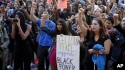 University California Los Angeles students stage a protest rally in a show of solidarity with protesters at the University of Missouri, in Los Angeles, Nov. 12, 2015,