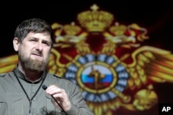 FILE - Chechen regional leader Ramzan Kadyrov speaks at a meeting marking the Interior Ministry Officer Day in Chechnya's provincial capital Grozny, Russia, Nov. 10, 2015.