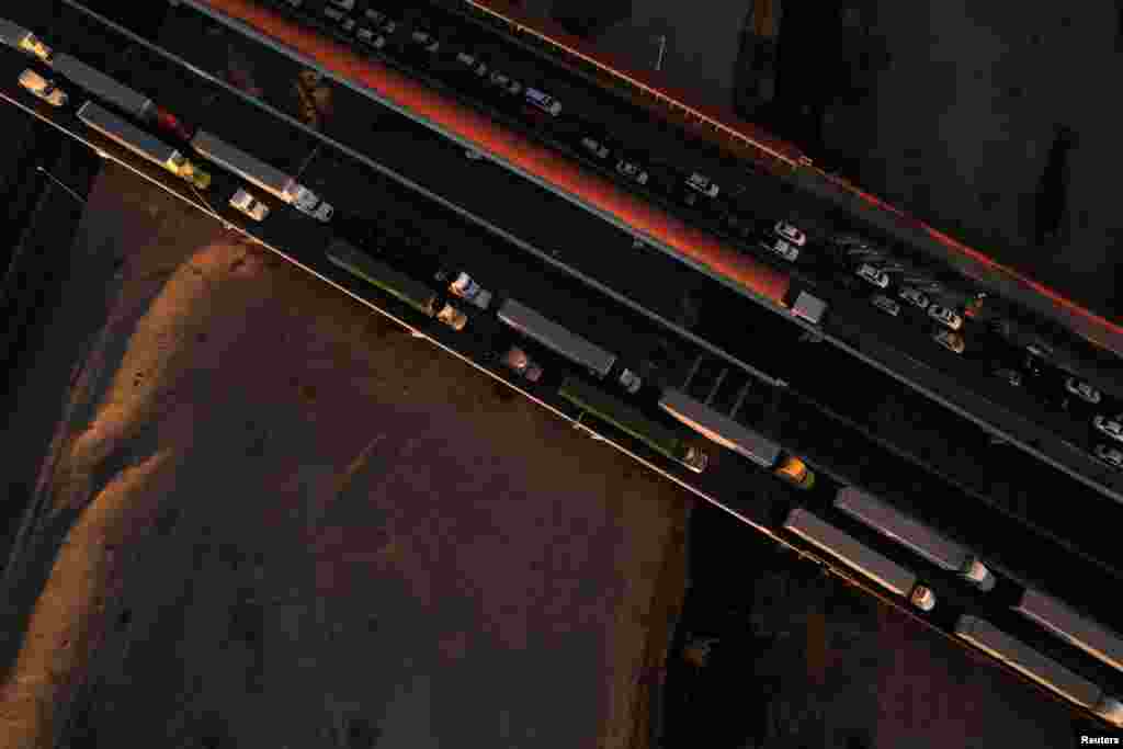 A drone view shows trucks waiting in line at the Zaragoza-Ysleta border crossing bridge to cross into the U.S., in Ciudad Juarez, Mexico, Nov. 26, 2024. 