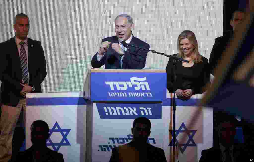Israeli Prime Minister Benjamin Netanyahu greets supporters at the party headquarters in Tel Aviv, March 18, 2015.