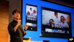 Joe Belfiore, Microsoft corporate vice president, Operating Systems Group, showcases the new Photos app for Windows 10, Jan. 21, 2015. Microsoft was not a "big gun" in its early days. It "got a break" when IBM selected its operating system for personal computers and grew into a "blue chip" company. (Ron Wurzer/AP Images for Microsoft)