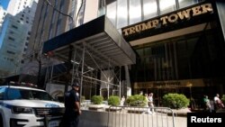 FILE - A police officer stands guard in front of Trump Tower before the arrival of former U.S. President Trump in New York City on April 12, 2023.