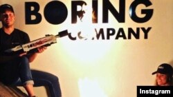 In this photo shared on social media by Tesla and SpaceX chief Elon Musk, people test out his Boring Company branded flamethrower that brought in $10 million in pre-sales. (Elon Musk/Instagram)