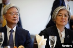 South Korean Foreign Minister Kang Kyung-wha (R), sits with South Korean Ambassador to the United States Ahn Ho-young prior to a meeting with the House Committee on Foreign Affairs in Washington, March 15, 2018.