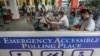 FILE - People and officials take part in a mock voting exercise held by the local government ahead of the country's 2022 national elections, at a school in Manila on Oct. 23, 2021. 