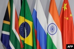 FILE - A general view of flags of (From L to R) South Africa, Brazil, Russia, India and China during the 2023 BRICS Summit at the Sandton Convention Centre in Johannesburg on August 24, 2023.