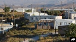 FILE - Amona, an unauthorized Israeli outpost in the West Bank, is seen east of the Palestinian town of Ramallah, Nov. 16, 2016. 